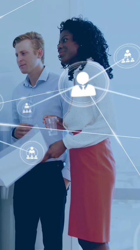 Vertical video: Pair watching talk, woman adjusting papers, sparking tech nodes Stock Footage 332546849