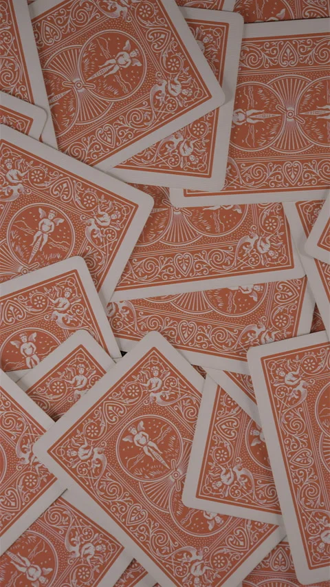 Vertical video pan across scattered red playing cards Stock Footage 340030152
