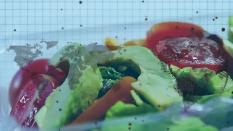Vertical video: Panning camera revealing salad in clear tub on map, showing Stock Footage 332428452
