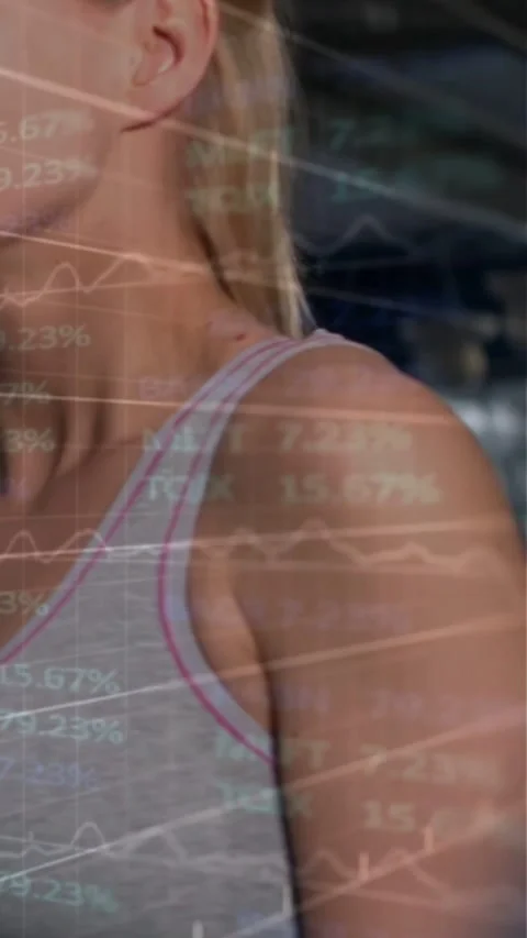 Vertical video: Panning camera showing model turning head right in gym, sports Stock Footage 334550308