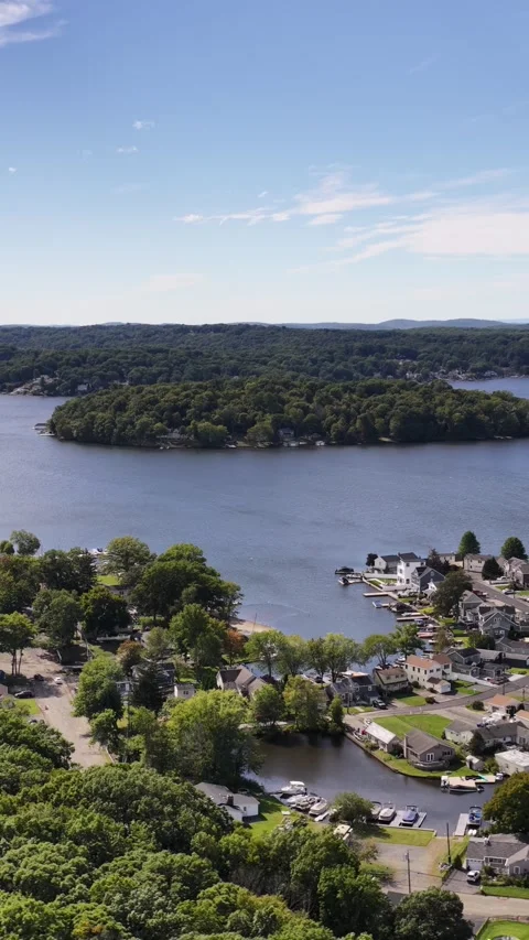 Vertical video pans across Lake Hopatcong waterfront homes Stock Footage 346882992