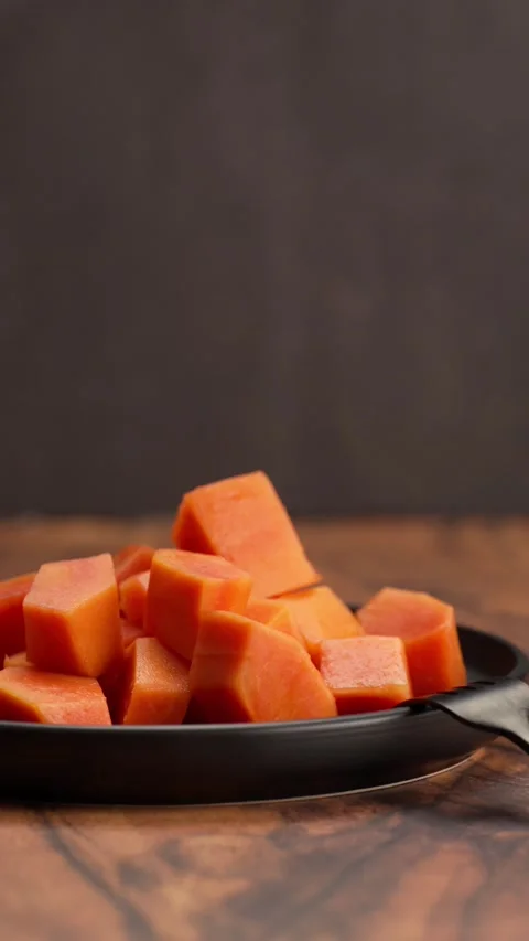 Vertical video, Papaya chopped into large cubes Stock Footage 328896638