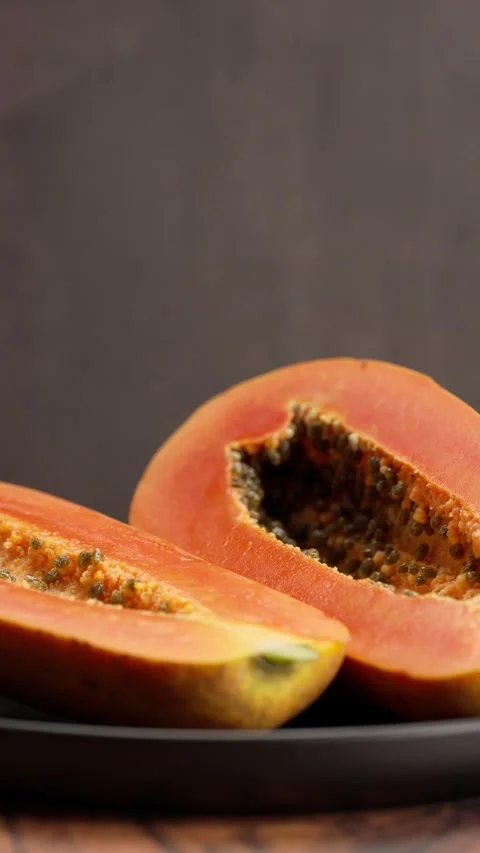 Vertical video, Papaya fruit cut in half Stock Footage 328896645