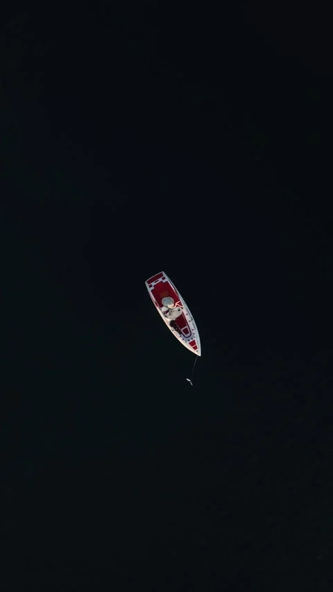Vertical Video: Parasailing Over the Bright Mediterranean Sea with Boats and Jet Stock Footage 297719323