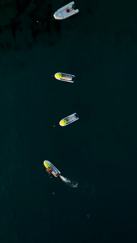 Vertical Video: Parasailing Over the Bright Mediterranean with Boats and Jet Stock Footage 297719520