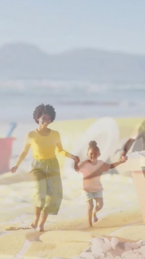 Vertical video: Parents playing lifting kid toward lens with bucket icons Stock Footage 331030573
