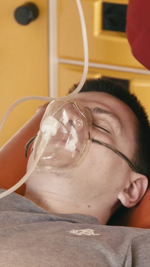 Vertical video. Patent, paramedic and blood pressure with oxygen mask Stock Footage 285148513
