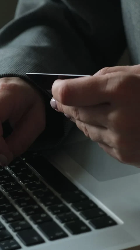 Vertical video. Paying online. Finalizing internet orders with bank card 動画素材 277192103