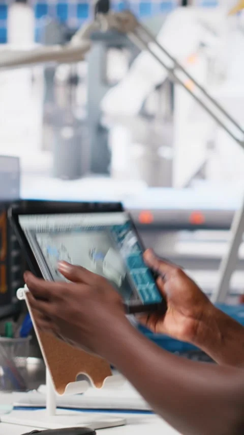 Vertical Video PC based solar technician reviews automation data in production Stock Footage 308979118