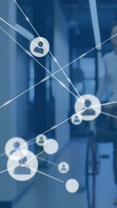 Vertical video: Peer with tote walking office sparking net nodes mapping team as Stock Footage 334546849
