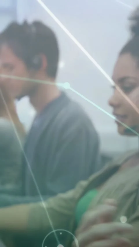 Vertical video: Peers typing as cam panning right, nodes moving across tech Stock Footage 334550530