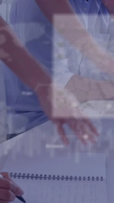 Vertical video: Pen moving drawing peer in, writer noting in spiral pad as maps Stock Footage 328331971