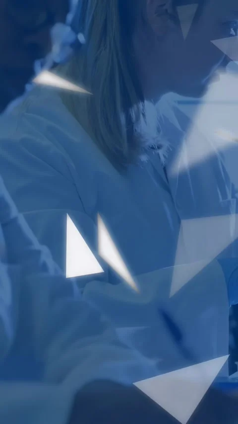 Vertical video: Pen writing starting pullback lab women noting as blue triangles Stock-Footage 331291479