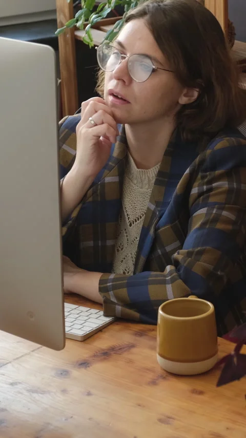 Vertical video. Pensive remote worker thinking about problem solution Stock Footage 317080478