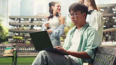 Vertical Video Pensive student pauses taking notes and thinking about ideas Stock Footage 340799141