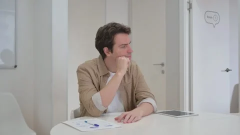 Vertical Video, Pensive Young Creative Man Brainstorming for Project Stock Footage 312914129