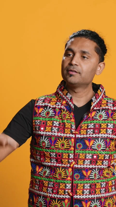 Vertical video Person doing calm down sign gesturing, studio background Stock Footage 274849224