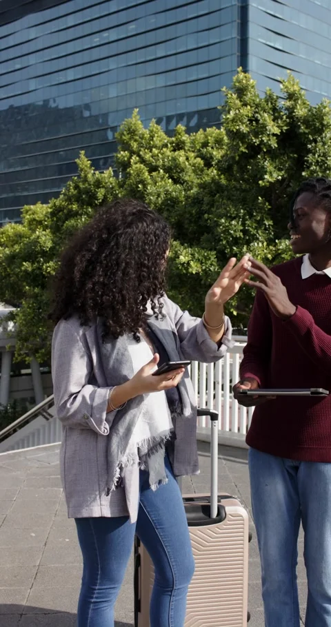 Vertical video: Phone alert urging diverse friends checking phone, tablet then Stock Footage 346718646