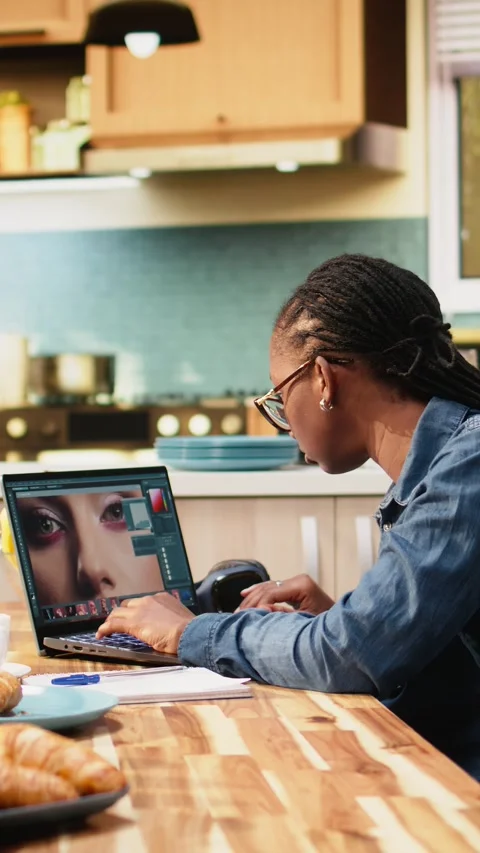 Vertical Video Photo editor designer retouching on laptop doing image selection Stock Footage 344529556