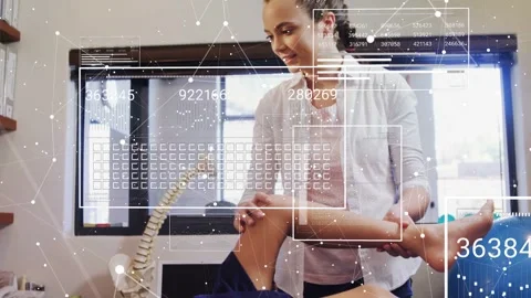 Vertical video: Physio placing hands on child leg, bending and testing ROM while Stock Footage 332592196