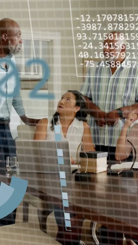 Vertical video: Pie chart appearing, team discussing business data at table, Stock Footage 333496778
