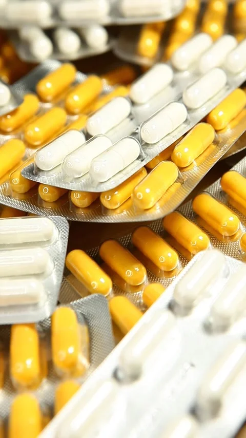 Vertical video of pills background Stock Footage 256974545