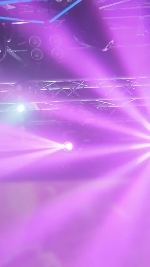 Vertical video: Pink rays motion of spotlights light in nightclub. Show Stock Footage 294071416