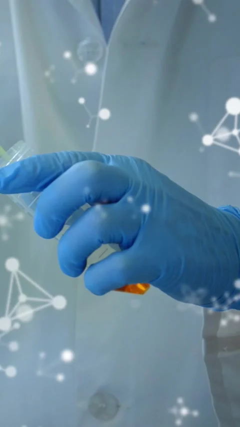 Vertical video: Pipette touching vial gloved hand moving orange sample for test Stock Footage 328398745