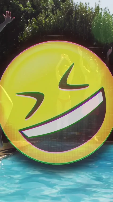 Vertical video: Pixel glitch entering forming emoji obscuring party crowd jumper Stock Footage 329961967