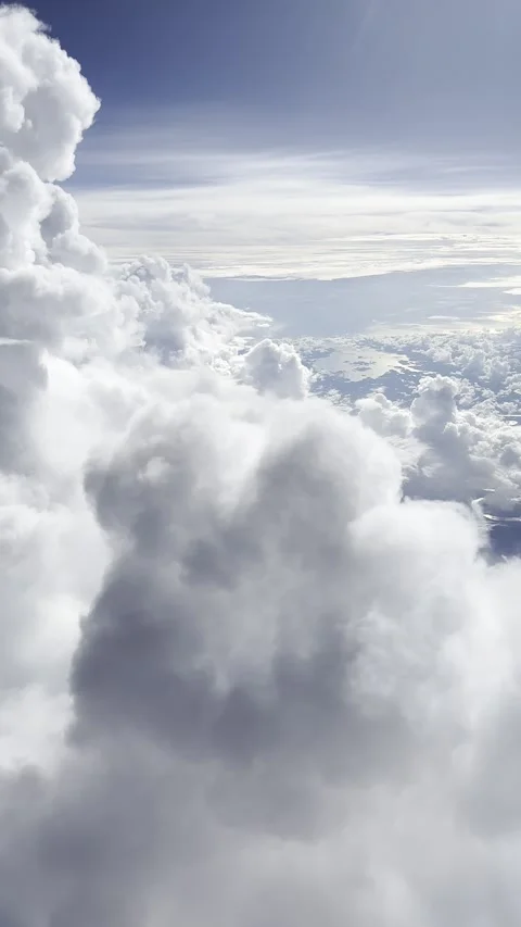 Vertical video from the plane window, beautiful clouds from the plane. Stock Footage 255225397