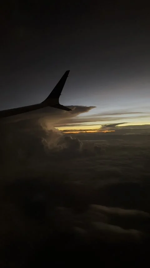 Vertical video from the plane window, beautiful clouds from the plane. Stock Footage 255225408