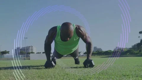 Vertical video: Planking, man in neon top doing pushups, rows with hex dumbbells Stock Footage 333396937