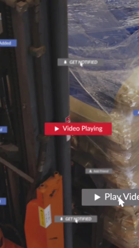 Vertical video: Play overlay starting, warehouse operator moving forks near Stock Footage 331790722