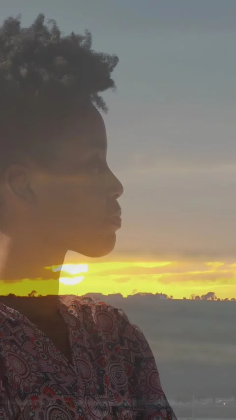 Vertical video: Play starting subject turning head right aligning sunset overlay Stock Footage 333020410