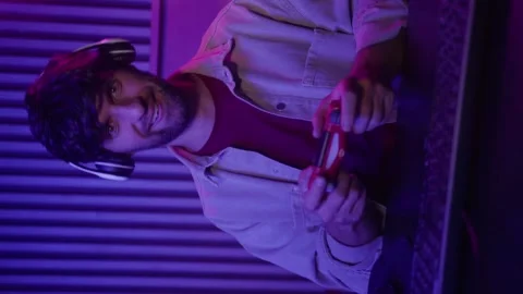 Vertical video: The player experiences an exciting moment of triumph, immersed Stock Footage 282356876