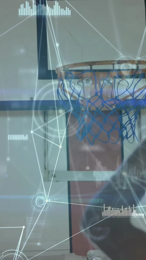 Vertical video: Player holding ball jumping and dunking at rim sports HUD Stock Footage 331077263