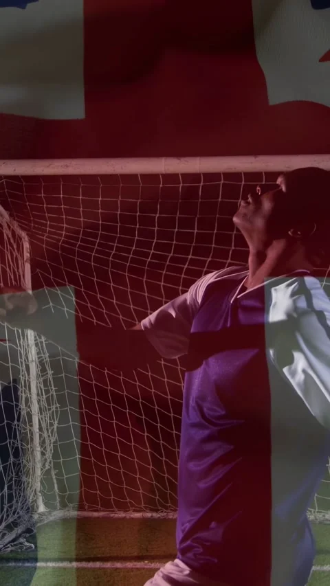 Vertical video: Player tracking overhead, doing backflip at goal net, red-blue Stock-Footage 333259871