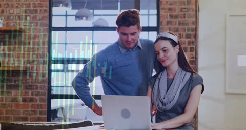 Vertical video: Pointing man in blue sweater and woman checking data on laptop Stock Footage 331460948