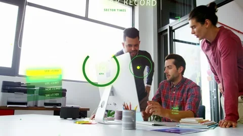 Vertical video: Pointing man in red shirt showing phone at desktop to team at Stock Footage 333139173