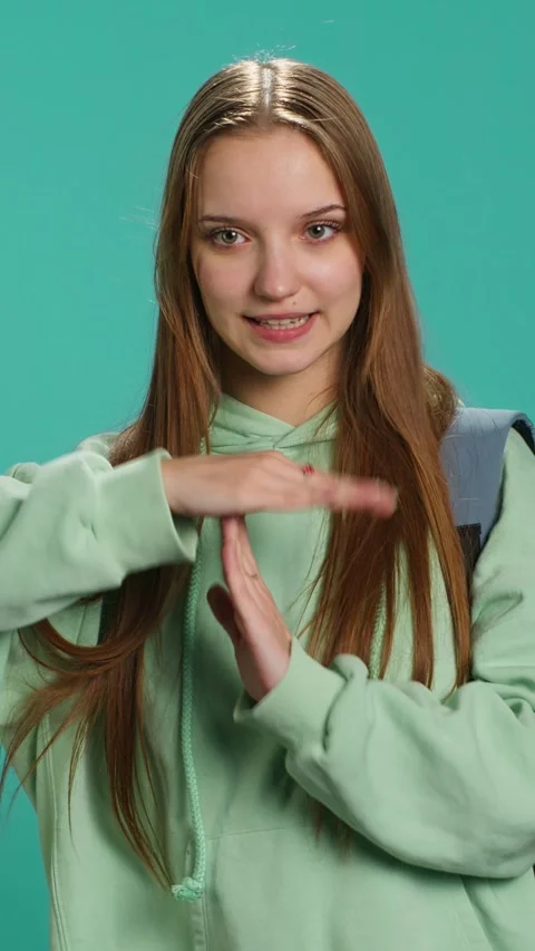 Vertical video Portrait of assertive woman asking for timeout, doing hand Stock Footage 276335463