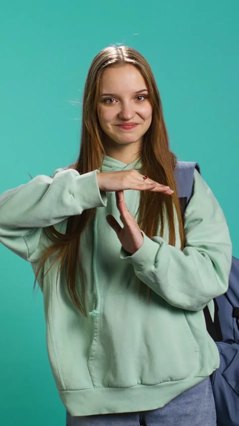 Vertical video Portrait of assertive woman asking for timeout, doing hand Stock Footage 276580494