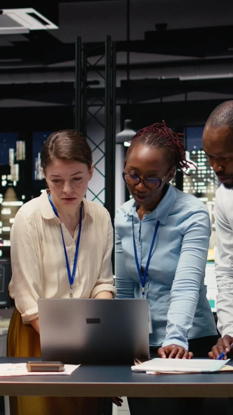 Vertical Video Portrait of associates team collaborating in office environment Stock Footage 334103549