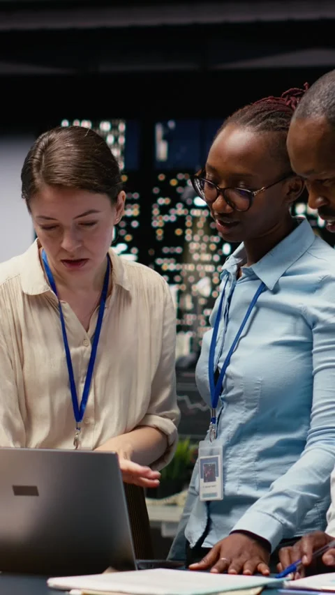 Vertical Video Portrait of associates team collaborating in office environment Stock Footage 334104581