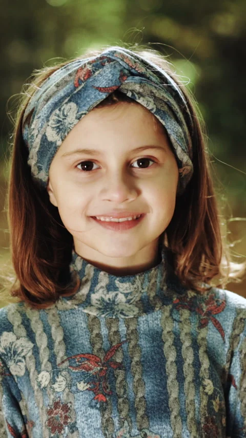 Vertical Video of Portrait authentic shot of carefree happy little girl is Stock Footage 304755951