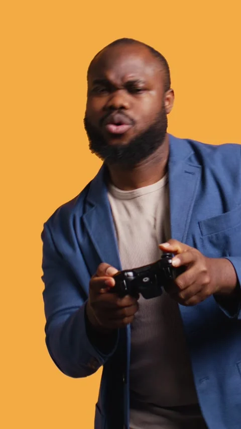 Vertical video Portrait of cheerful man playing videogames with controller Stock Footage 273000582