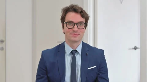 Vertical Video, Portrait, Confident Young Businessman Shaking Head in Approval Video stock 312914686