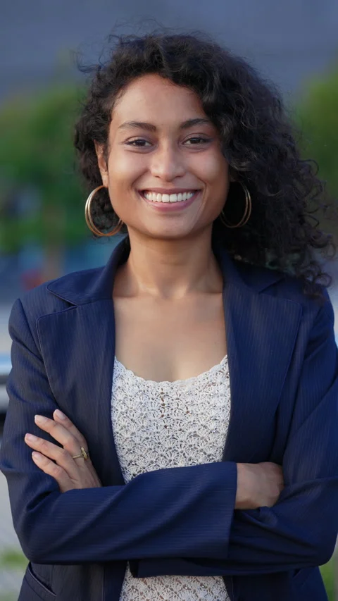 Vertical Video. Portrait of the Curly Haired Beautiful Woman Standing Outside in Stock Footage 304761111