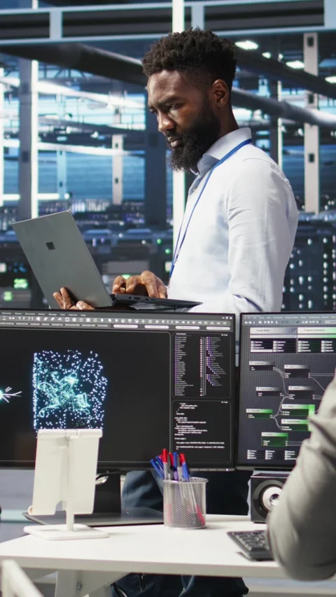 Vertical video Portrait of data center engineer analyzing gear issues using node Stock Footage 307969216