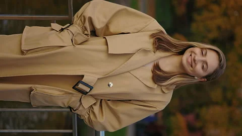 Vertical Video. Portrait of Gorgeous Caucasian Woman Smiling Charmingly while Stock Footage 237449853