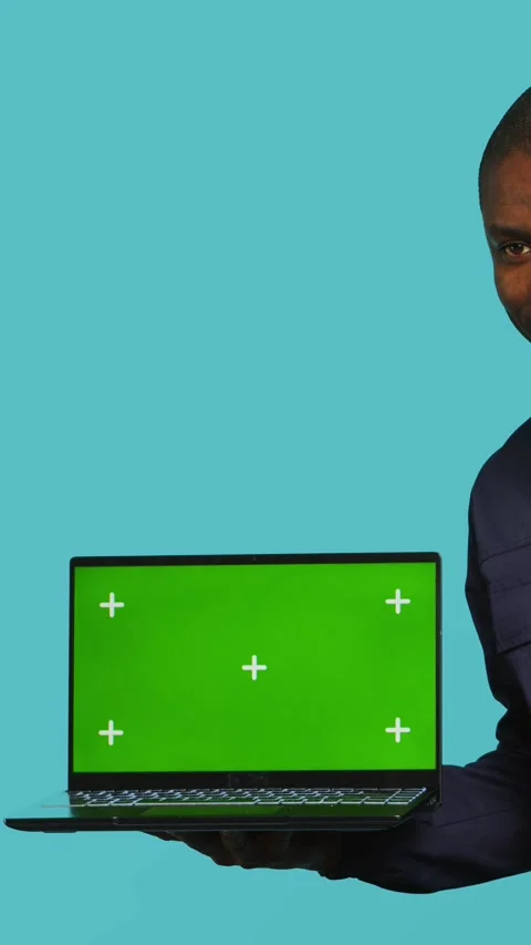 Vertical video Portrait of happy security guard at work showcasing green screen Stock Footage 277962391